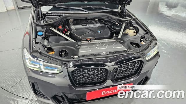BMW X4 2023 — ფოტო 5/20