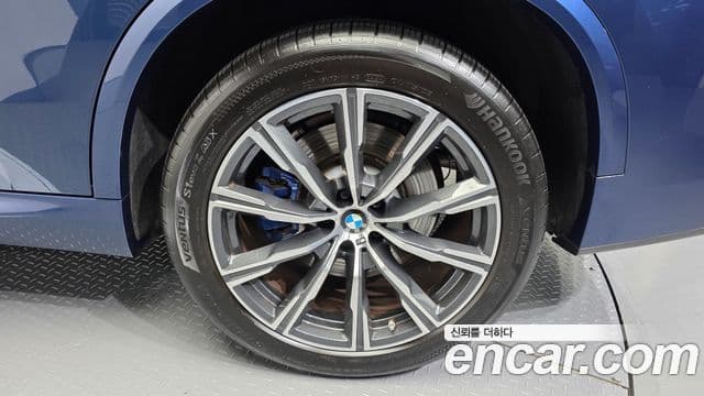BMW X5 2021 — ფოტო 14/34