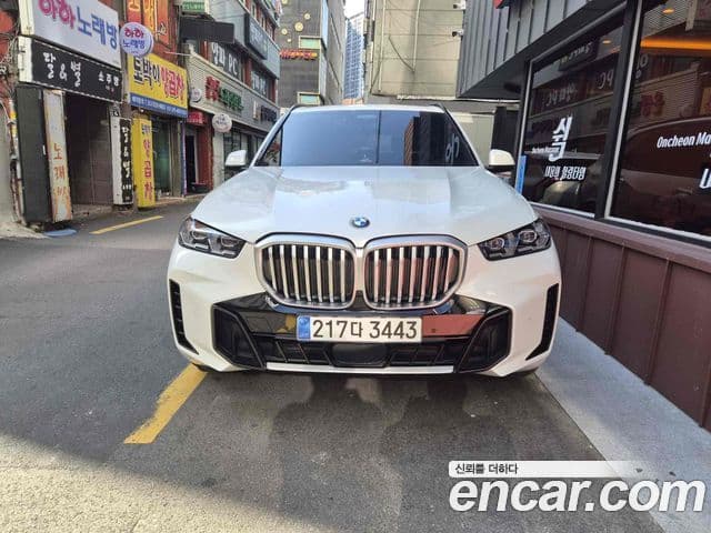 BMW X5 2023 — ფოტო 1/10