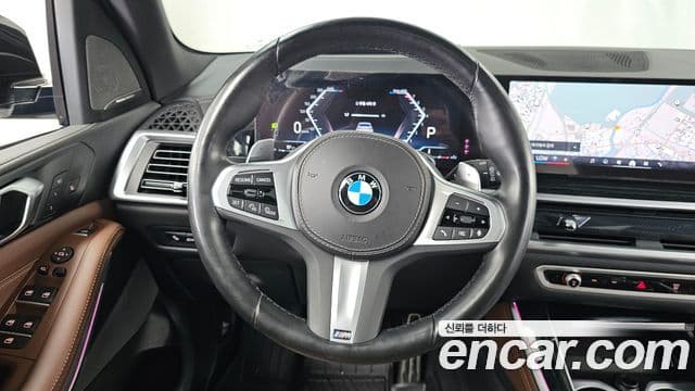 BMW X5 2023 — ფოტო 13/20
