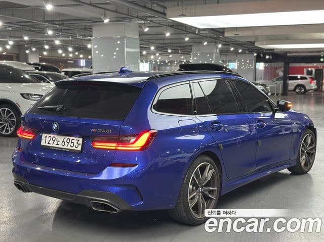 BMW 3 Series 2021 — ფოტო 1/12