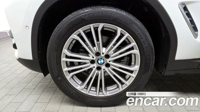 BMW X3 2021 — ფოტო 1/32