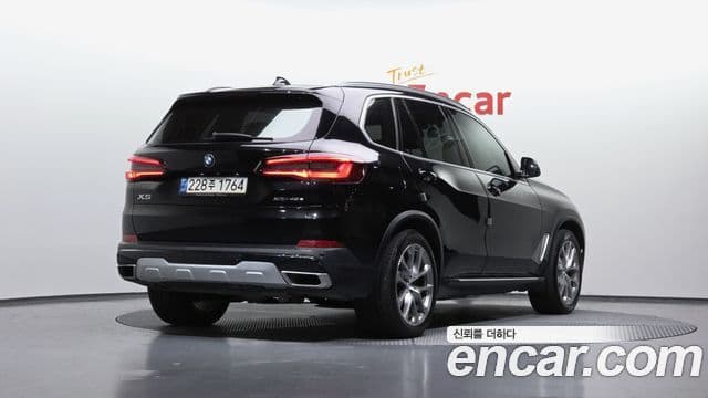 BMW X5 2021 — ფოტო 13/20