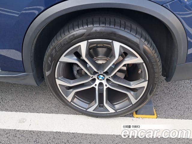 BMW X5 2021 — ფოტო 12/18