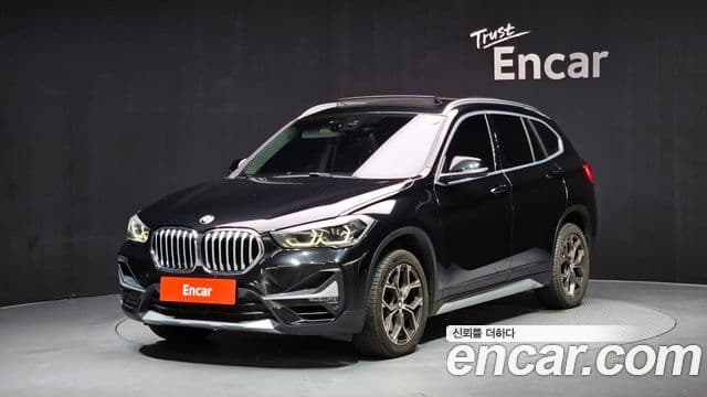 BMW X1 2021 — ფოტო 1/20