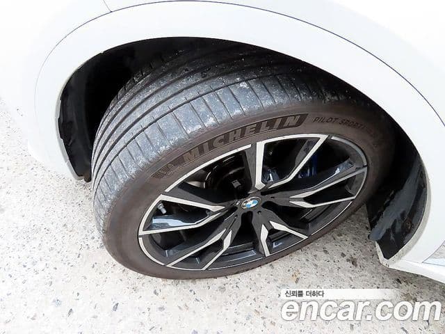 BMW X7 2020 — ფოტო 7/20