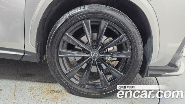 Lexus NX450h+ 2024 — ფოტო 1/37