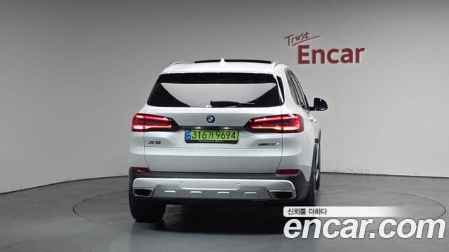 BMW X5 2023 — ფოტო 4/20