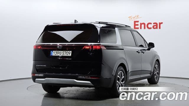 Kia Carnival 2021 — ფოტო 1/20
