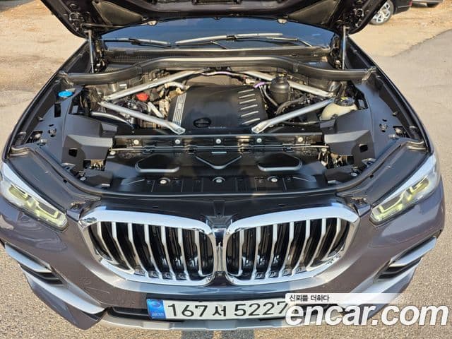 BMW X5 2022 — ფოტო 7/20