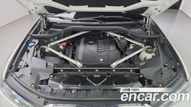 BMW X7 2022 — ფოტო 6/20