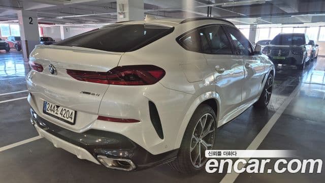 BMW X6 2023 — ფოტო 1/8