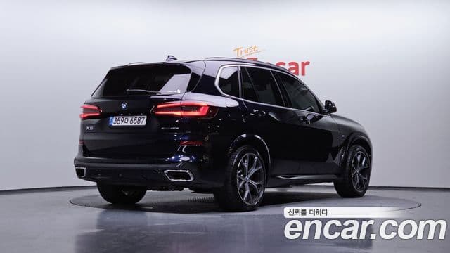BMW X5 2021 — ფოტო 13/20