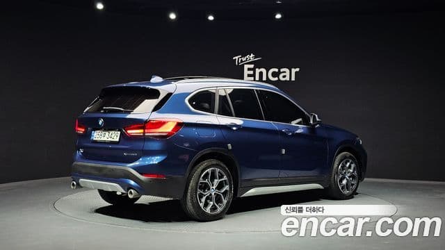 BMW X1 2021 — ფოტო 1/20