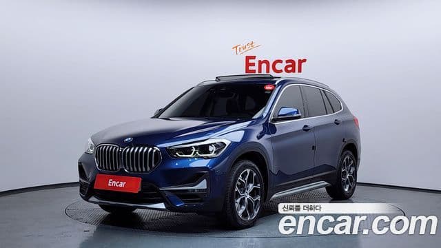 BMW X1 2021 — ფოტო 1/20