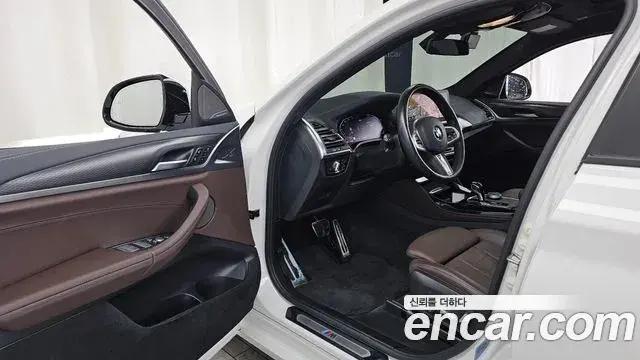 BMW X4 2022 — Фото 10/20