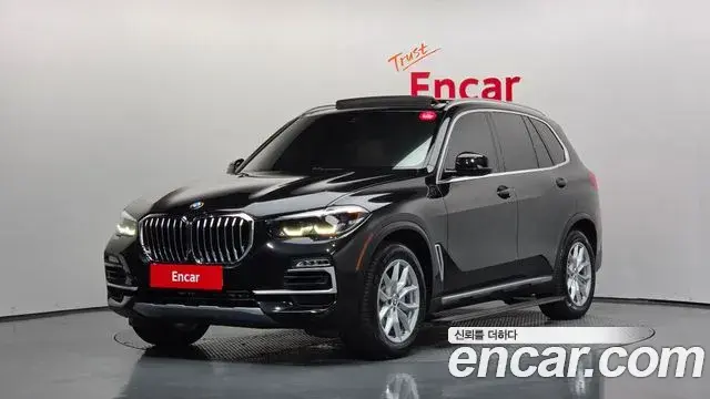 BMW X5 2019 — Фото 1/20