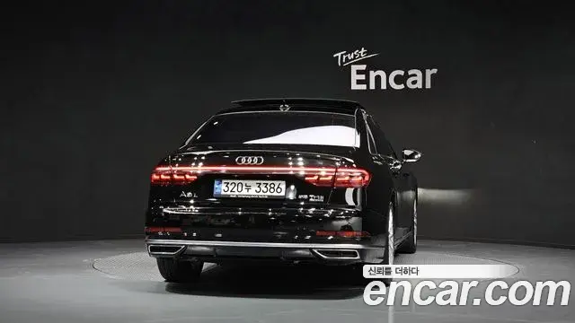 Audi A8 2021 — Фото 4/20