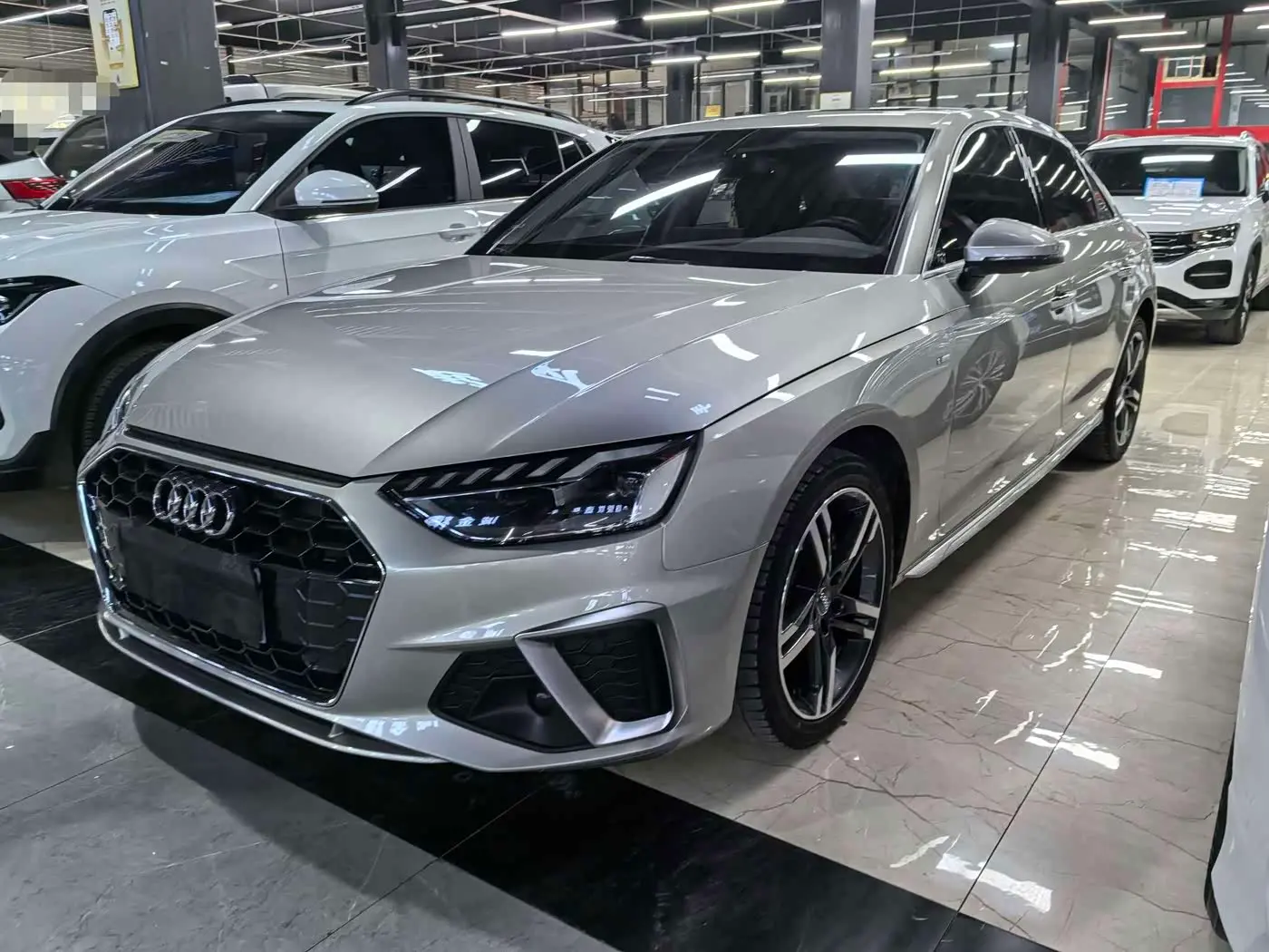 Audi A4L 2021 — Фото 1/12